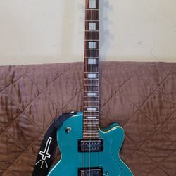 DEARMOND M-66 SINGLE CUT ELECTRIC GUITAR MADE IN INDONESIA TURQUOIS CARVED TOP IN BLUE COLOR. 
