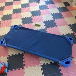 Children's dining table, chair, crib, and toys