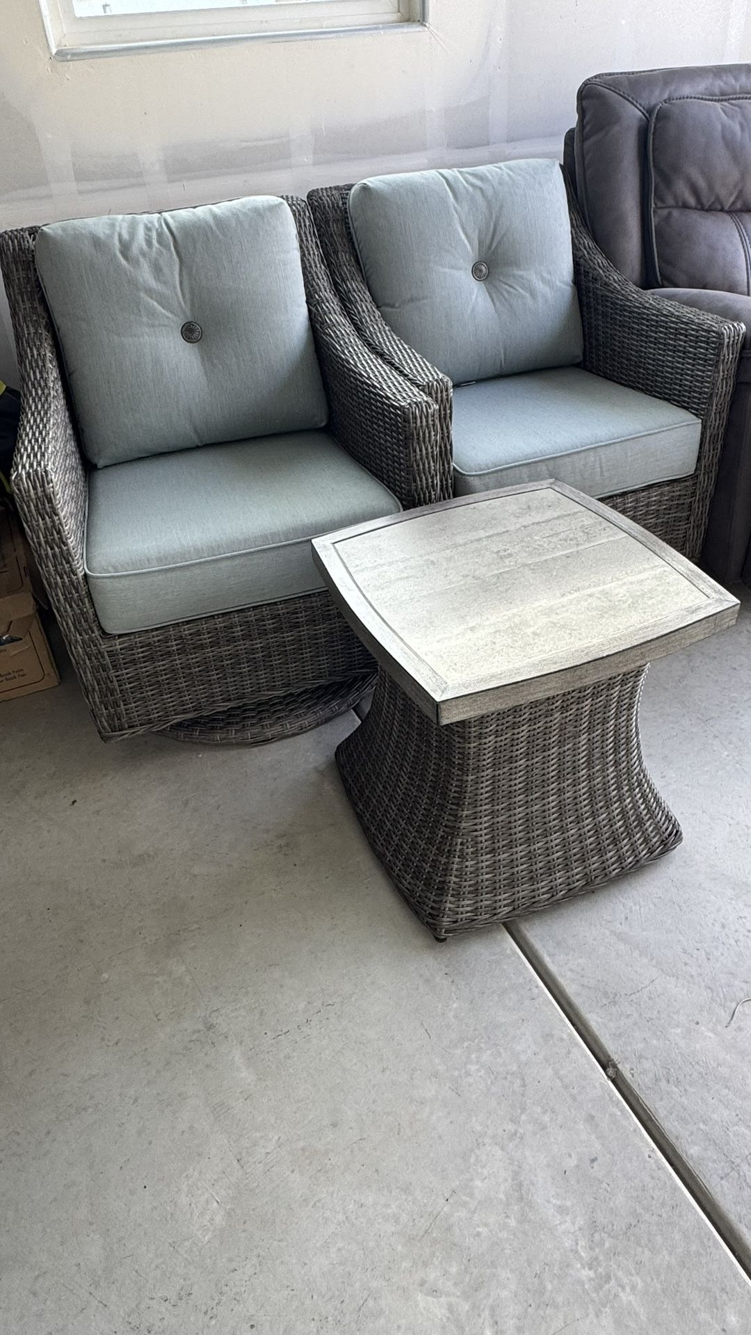2 Swivel Wicker Chairs And Table