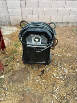 This black Lincoln Electric AC-225-S arc welder features a variable amperage control dial from 40 to 225 amps.