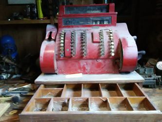 Red and white antique cash register