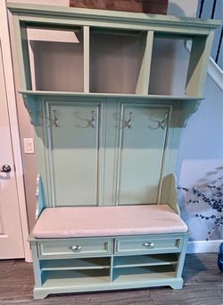 Antique bench with storage and coat hooks