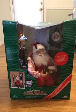 Antique Santa and puppy by grandfather clock
