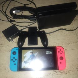 Nintendo Switch with the DOC to tv, Breath of the wild and super smash bros ultimate