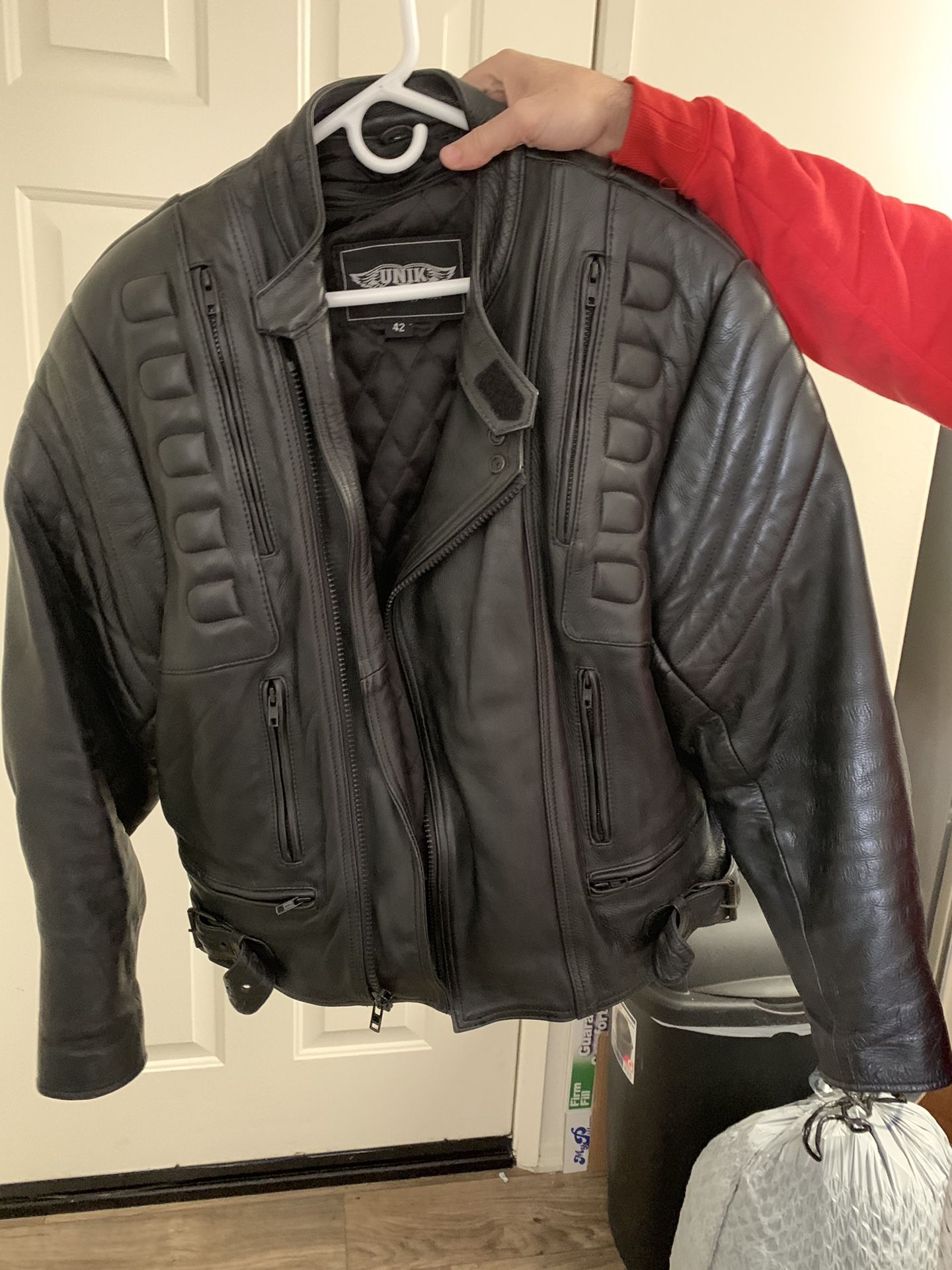 Leather motorcycle padded jacket with zipper vents. Also has zip out lining.