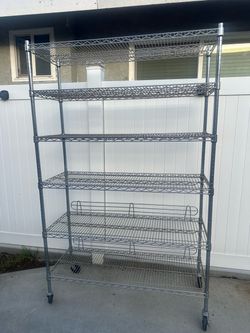 Metal shelf with wheels $150 OBO