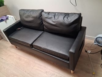 Black faux leather loveseat with USB ports