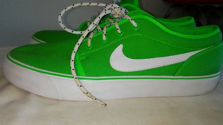 Mens green nikes price is firm need $25 basically new used 1 size 9.5