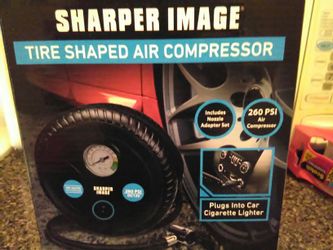 Brand new tire compressor plugs in cigarette lighter