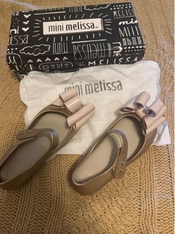 Cute Mini Melissa shoes for girls size 11 $30 or both for $50 hablo español.