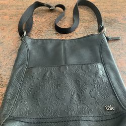 The SAK Black Leather Crossbody Hobo  Bag   12”x11”     Inside And Outside Pockets  Bag Is Very Good Condition  with wear stains  Inside by zipper   