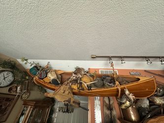 This is a custom handcrafted cedar strip-built wooden canoe.