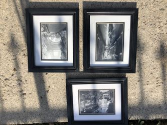 3 black frame pictures