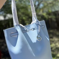 This is a Michael Kors Carson Large Pebbled Leather Tote Bag in the color Light Sky.