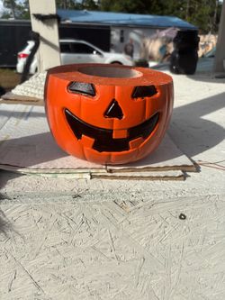 Concrete Halloween pumpkin jack-o’-lantern planter