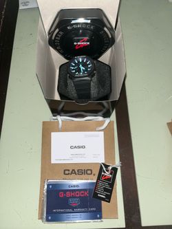 Black and blue g shock watch