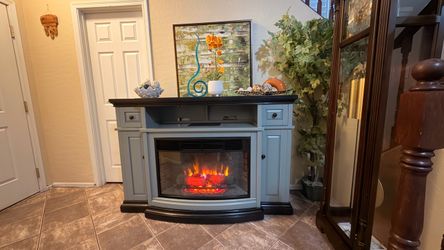Beautiful fireplace /tv stand in excellent condition 64” inches long