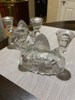 Beautiful set of 2 vintage crystal glass candelabras. Each holds 4 candles and features an elegant cut-glass design with a classic, timeless look. Per