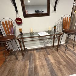 Vintage Wrought lron swivel barstools by Charleston Forge elevated on tubular legs w/ foot bar & curved stretchers