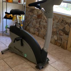 Upright, stationary exercise bike