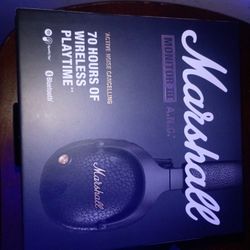 Marshall over-ear wireless headphones. Active noise cancelling and Bluetooth. Prominent Marshall logo and textured earcups. Gold-tone accent on earcup