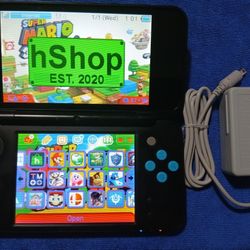 New Nintendo 2DS XL With Charger And Games Inside 