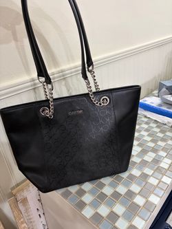 Calvin Klein purse/handbag 16 inch wide by 10 1/2 inch height excellent condition only used one time like new many items in my listing
