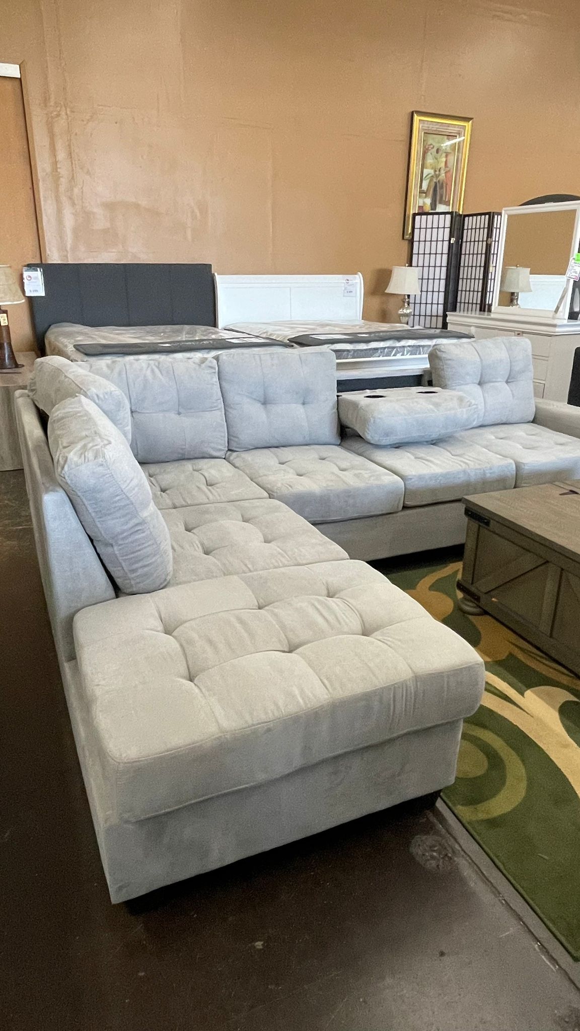 Gray Reversible Sectional with Drop Down Cupholder