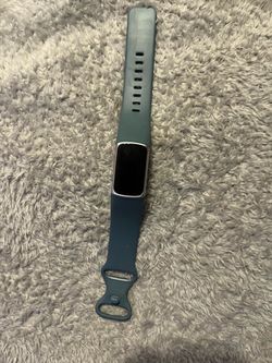 Fitbit Charge 5 fitness and health tracker in the Steel Blue and Platinum Stainless Steel colorway