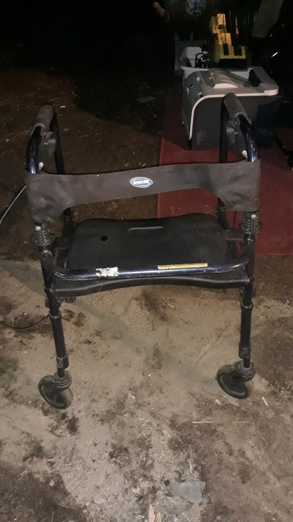 Invacare walker with seat and brakes