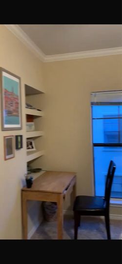 Wooden desk and off white chair