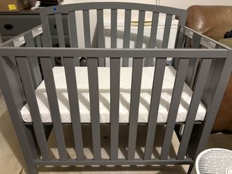 Gently Used Gray Mini Crib