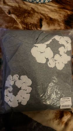 grey denim tear
