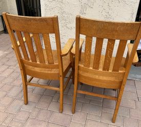Vintage oak captain chairs