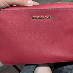 Michael Kors Jet Set Saffiano leather crossbody bag in a red/watermelon color