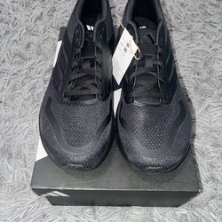 Size 10.5, men’s brand new unworn Adidas shoes wth tags and box