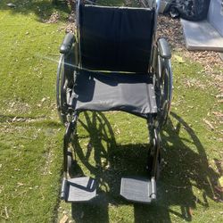 Adult Wheelchair With Footrest Folds Up 