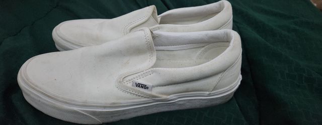 Vans Classic Slip-On canvas sneakers in true white.