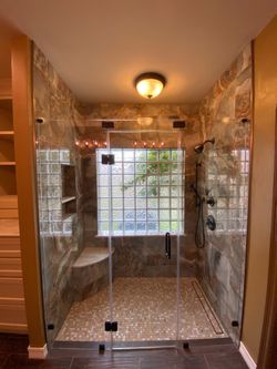 Windows , mirrors and shower glass door .
