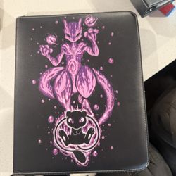 2 binders full of pokemon cards