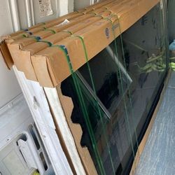 Brand New 115.5W x 95H PGT Vinyl Sliding Door with Frame.
