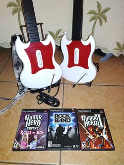 PlayStation 2 Red Gibson guitars, stand and games