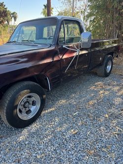 Classic Dark Red Square Body Pickup Truck