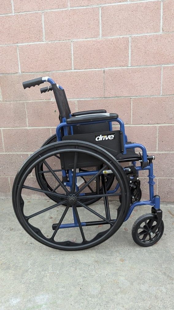 Drive Medical Blue Streak Wheelchair with Flip Back Desk Arms.