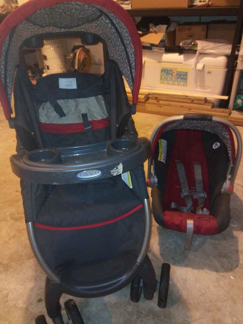 Graco red and gray stroller with car base