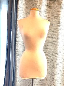 Woman’s foam dress form on metal stand