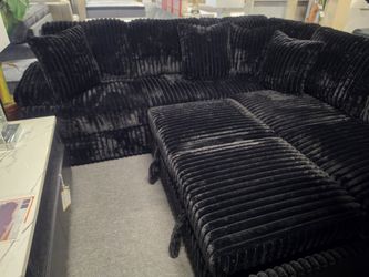 BRAND NEW BLACK CORDUROY SECTIOONAL WITH SOFA SLEEPER AND STORAGE CHAISE