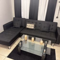 Black L-style futon sectional sofa with chrome legs"