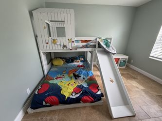White wood frame twin over full house bunk bed with slide