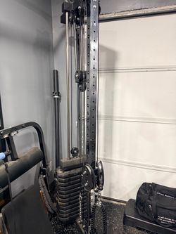 heavy-duty adjustable cable/functional trainer with a selectorized weight stack